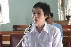 “Đinh tặc” Nguyễn Thế Công bị xét xử tại tòa án vào sáng 14/7. (Ảnh: Dương Chí Tưởng/Vietnam+)