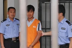 Fu Xuesheng bị cảnh sát bắt giữ. (Nguồn: Xinhua)