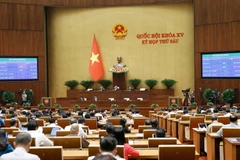 Sáng 28/11, Quốc hội đã lấy ý kiến biểu quyết về Luật Kinh doanh Bất động sản (sửa đổi). (Ảnh: Doãn Tấn/TTXVN)