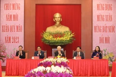 Các đồng chí lãnh đạo Đảng, Nhà nước tham dự buổi chúc Tết. (Ảnh: Phương Hoa/TTXVN)