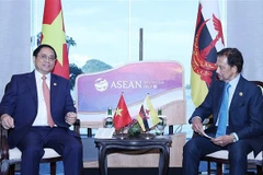 Thủ tướng Phạm Minh Chính gặp Quốc vương Brunei Hassanal Bolkiah. (Ảnh: Dương Giang/TTXVN)
