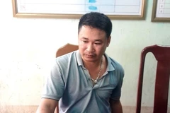 Trần Anh V. đã cầm theo hung khí đến Công an xã Quảng Châu tự thú. (Ảnh: TTXVN phát)