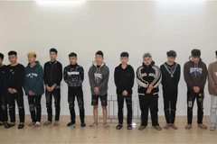 Các đối tượng tại cơ quan điều tra. (Ảnh: Thanh Thương/TTXVN)