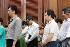 Các bị cáo nghe tuyên án. (Ảnh: Thành Chung/TTXVN)