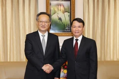 Tổng Giám đốc Thông tấn xã Việt Nam Nguyễn Đức Lợi tiếp đồng chí Trương Túc Đường, Phó Xã trưởng Tân Hoa Xã. (Ảnh: Dương Giang/TTXVN)