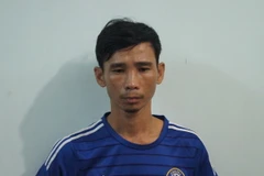 Đối tượng Trần Hữu Việt tại Cơ quan công an Bình Dương. (Ảnh: Nguyễn Văn Việt/TTXVN)