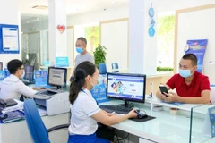 VNPT đảm bảo quy tắc phòng dịch trong hoạt động sản xuất kinh doanh. (Ảnh: T.Q/Vietnam+)