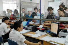 Sở Kế hoạch và Đầu tư Hà Nội đẩy mạnh công tác đăng ký doanh nghiệp qua mạng. (Ảnh: TTXVN)