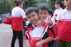 Chương trình đã mang Tết đến gần hơn với hàng ngàn em nhỏ có hoàn cảnh khó khăn. (Ảnh: PV//Vietnam+)