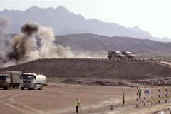 Xe trinh sát NBC của Việt Nam trên đường đua của phần thi tiếp sức. (Ảnh: TTXVN phát)