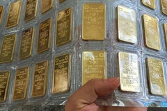 Ngân hàng nhà nước đề nghị Bộ Công an phối hợp trong quản lý thị trường vàng. (Ảnh: Vietnam+)