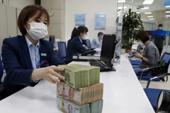 4 ngân hàng thương mại cổ phần Nhà nước đồng loạt giảm mạnh lãi suất huy động. (Ảnh: PV/Vietnam+)