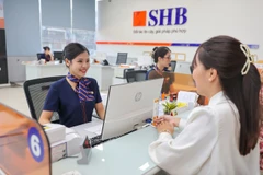 Hỗ trợ tối đa cho khách hàng Micro SME, ngân hàng đang trong quá trình đẩy mạnh chuyển đổi số, cải cách, đơn giản hóa quy trình, thủ tục nội bộ, rút ngắn thời gian xét duyệt cho vay. (Ảnh: Vietnam+)