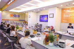 Giao dịch tại SHB. (Ảnh: Vietnam+)