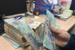 Hầu hết các ngân hàng đã giảm lãi suất huy động. (Ảnh: Vietnam+)