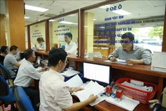 Hoạt động tại Cục Thuế Hà Nội. (Ảnh: TTXVN phát)