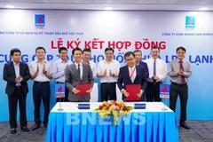 Quang cảnh buổi ký kết. (Ảnh: Hằng Anh/Bnews/Vietnam+)