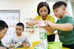 Học sinh trường Mẫu giáo Mầm non A, quận Hoàn Kiếm trong giờ học trước khi có dịch COVID-19. (Ảnh: Thanh Tùng/TTXVN)