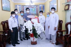 Đoàn công tác Ban Tôn giáo Chính phủ chúc mừng Ban đại diện Hội thánh Cao Đài Tòa thánh Tây Ninh tại Thành phố Hồ Chí Minh nhân đại lễ Hội Yến Diêu Trì Cung. (Ảnh: Xuân Khu/TTXVN)