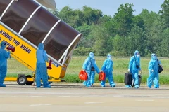 Công dân từ Thành phố Hồ Chí Minh về đến Thanh Hóa. (Ảnh: Trịnh Duy Hưng/TTXVN)