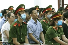Các bị cáo tại phiên tòa xét xử sơ thẩm. (Ảnh: Trọng Đạt/TTXVN) 
