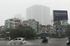 Mưa lớn gây ngập cục bộ tại Hà Nội ngày 30/7. (Ảnh: Trọng Đạt/TTXVN)