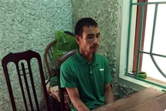 Đối tượng Bùi Văn Tiển tại cơ quan điều tra. (Ảnh: Vũ Hà/TTXVN)