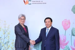 Giám đốc Học viện Chính trị Quốc gia Hồ Chí Minh Nguyễn Xuân Thắng và Thượng Nghị sỹ Penny Wong, Bộ trưởng Bộ Ngoại giao Australis đồng chủ trì diễn đàn. (Ảnh: Văn Điệp/TTXVN)