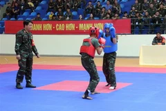 Các vận động viên tiến hành thi đấu vòng loại. (Ảnh: Trung Kiên/TTXVN)