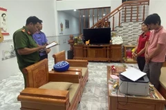 Cơ quan điều tra công bố quyết định khởi tố bị can Tạ Duy Phước. (Ảnh: TTXVN phát)