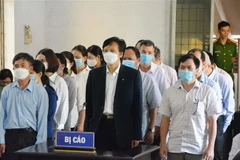 Các bị cáo tại phiên tòa xét xử sơ thẩm hồi tháng 9/2022. (Ảnh: Tuấn Anh/TTXVN)