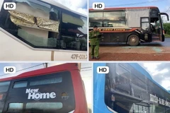 Các xe khách bị ném đá. (Ảnh: TTXVN phát)