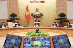 Thủ tướng Phạm Minh Chính chủ trì Hội nghị trực tuyến Chính phủ với địa phương. (Ảnh: Dương Giang.TTXVN)
