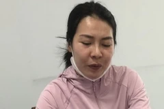 Đối tượng Phạm Thị Huỳnh Như tại cơ quan công an. (Ảnh: TTXVN phát)