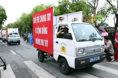 Diễu hành hưởng ứng Tháng hành động, phòng chống ma túy. (Ảnh: Phạm Kiên/TTXVN)