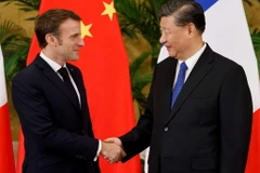 Tổng thống Pháp Emmanuel Macron và Chủ tịch Trung Quốc Tập Cận Bình. (Nguồn: DW)