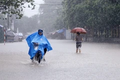 Mưa lớn gây ngập úng tại nhiều tuyến đường trong trung tâm T.P Thái Nguyên. (Ảnh: Lan Anh/TTXVN)