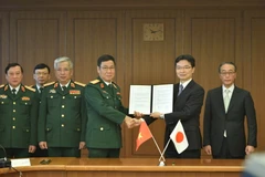 Quang cảnh lễ ký Bản tham chiếu về hợp tác công nghiệp quốc phòng song phương trong khuôn khổ đối thoại. (Ảnh: Nguyễn Tuyến/TTXVN)
