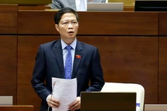 Bộ trưởng Bộ Công thương Trần Tuấn Anh giải trình ý kiến của đại biểu Quốc hội về dự án Luật quản lý ngoại thương. (Ảnh: An Đăng/TTXVN)