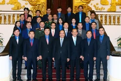 Thủ tướng Nguyễn Xuân Phúc chụp ảnh chung với các đại biểu. (Ảnh: Thống Nhất/TTXVN)