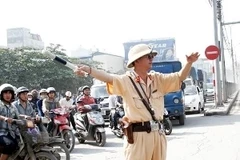 Cảnh sát giao thông sẽ phân luồng giao thông trong thời gian diễn ra thi Đại học. (Ảnh: Mạnh Hùng/Vietnam+)