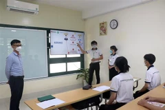 Các ứng viên xuất khẩu lao động đang học tập tại trường đại học Sư phạm Kỹ thuật Vĩnh Long. (Ảnh: Lê Thúy Hằng/TTXVN)