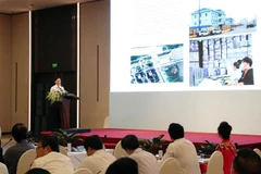 Giám đốc Sở Giao thông Vận tải Thành phố Hồ Chí Minh Trần Quang Lâm trình bày quy hoạch giao thông vận tải thành phố. (Ảnh: Tiến Lực/TTXVN)