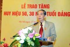 Đồng chí Trương Quang Được tại buổi Lễ trao tặng Huy hiệu 50 năm tuổi Đảng. (Ảnh: An Đăng/TTXVN)