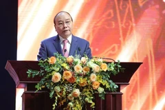 Chủ tịch nước Nguyễn Xuân Phúc phát biểu khai mạc Lễ trao giải. (Ảnh: Hoàng Đạt/Vietnam+)