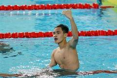 Niềm vui của vận động viên Phạm Thanh Bảo (Việt Nam) giành Huy chương Vàng nội dung 50m bơi ếch nam với thành tích 28 giây 28. (Ảnh: Phạm Kiên/TTXVN)