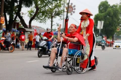 Cổ động viên Việt Nam náo nức chờ đón trận đấu giữa U23 Việt Nam và U23 Malaysia. (Ảnh: Ngô Trần Hải An/Vietnam+)