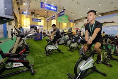 Gian triển lãm thiết bị phòng tập của Công ty Động Lực. (Ảnh: Trần Việt/TTXVN)