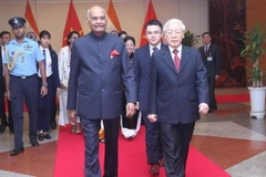 Tổng Bí thư, Chủ tịch nước Nguyễn Phú Trọng và Tổng thống Ấn Độ Ram Nath Kovind đến dự tiệc chiêu đãi. (Ảnh: Lâm Khánh/TTXVN)