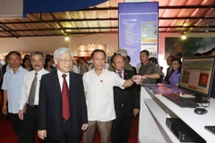 Tổng Bí thư Nguyễn Phú Trọng thăm gian hàng trưng bày và giới thiệu về 70 năm Thông tấn xã Việt Nam (ảnh tư liệu). (Ảnh : Trí Dũng/TTXVN)